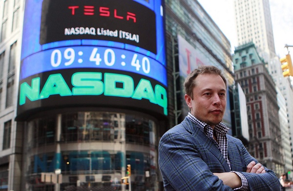 Image: CEO of Tesla Motors Elon Musk poses during a television interview after his company's initial public offering at the NASDAQ market in New York