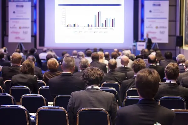 Delegates watching a business presentation during a conference