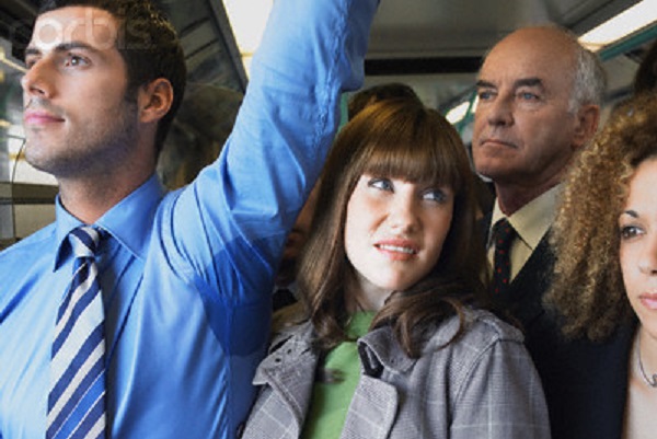 Commuter Standing by Man's Wet Armpit on Train