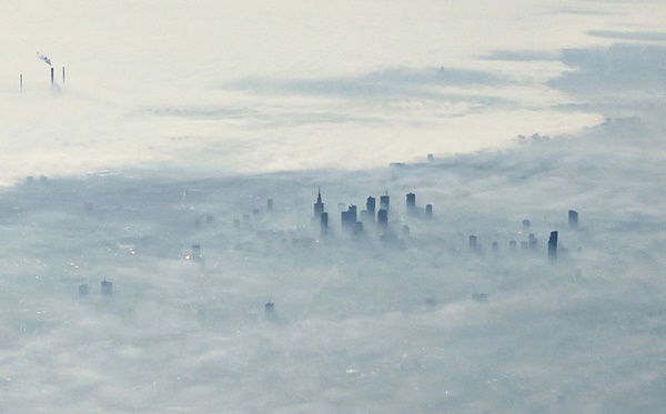 warsaw-poland-covered-in-fog-from-an-airplane-aerifal-from-above-06