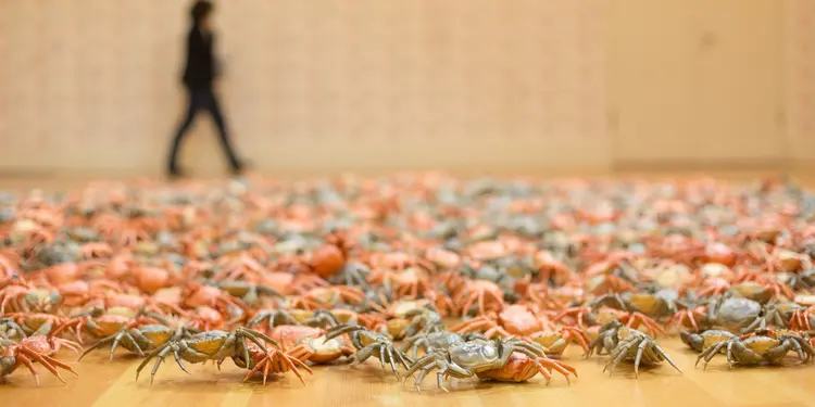 BERLIN, GERMANY - APRIL 02: A visitor passing by the work 'He Xie' , or 'Crabs' at the press preview for Chinese artist Ai Weiwei 'Evidence' exhibition at Martin Gropius Bau on April 2, 2014 in Berlin, Germany. The exhibition opens to the public on April 3 and runs until July 7, 2014. (Photo by Christian Marquardt/WireImage)