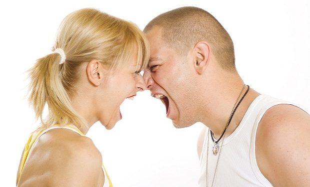 Angry twenty something couple yelling at each other