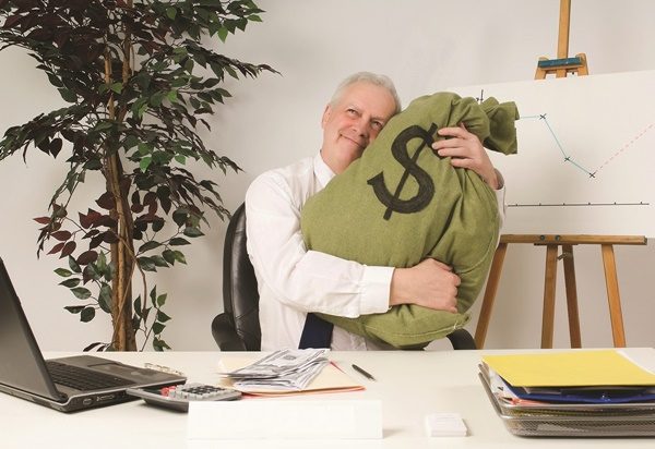 Bank Manager Hugging Bag Of Money