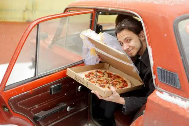 Pic shows: 22-year-old Russian marries a pizza.nnA lonely Russian gourmet fed up of not having a better half has married a pizza.nnThe bizarre wedding ceremony took place in a pizzeria in the city of Tomsk, in the Tomsk Oblast region that is located in south-central Russia.nnThe man who was not named said he came up with the idea because she was fed up of being alone.nnHe said: "At some point I realized that half of my friends are complaining about their better half, while the others were complaining about the lack of a better half."nn"Love between two humans is a complicated wild thing. I was grateful that I had at least my love of food and then it came to me that actually love for food remains stable no matter what."nn"Pizza would not reject you or betray you, and speaking quite frankly and sincerely, I love it."nnSceptical Russian authorities refused to give official permission to register the unusual marriage at a registry office, and the church also turned him down.nnSo in the end the unusual ceremony went ahead in one of the city¿s pizzerias. Managers and cooks at the restaurant even went as far as to provide the man with a certificate of marriage, and the pizza bride was covered in a bridal veil.nnAfter that the happy groom posed in front of many cameras with his "wife". Details of what they did on their honeymoon night together were not revealed.nn(ends)