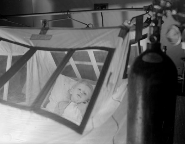 circa 1937: A young patient, Gerald Blackburn, in an oxygen tent at Princess Beatrice Hospital. (Photo by London Express/Getty Images)