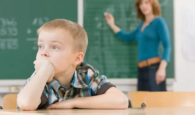 Distracted Student in Classroom --- Image by © Wolfgang Flamisch/Corbis