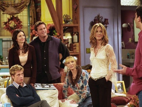 Brad Pitt, front left, joins the cast of NBC's television show "Friends" as a mystery guest on their Thanksgiving episode to air Thursday, Nov. 22, 2001. Cast members, from left, Courteney Cox Arquette, Matthew Perry, Lisa Kudrow and Jennifer Aniston, look at David Schwimmer, right. (AP Photo/NBCMV/Warner Bros., Danny Feld) Original Filename: FRIENDS_THANKSGIVING_WXS105.jpg