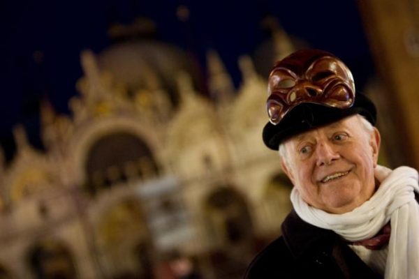 Dario Fo, Italy's Nobel laureate playwright, smiles as he poses with a mask in front of St Mark basilic during the Venetian Carnival in Venice