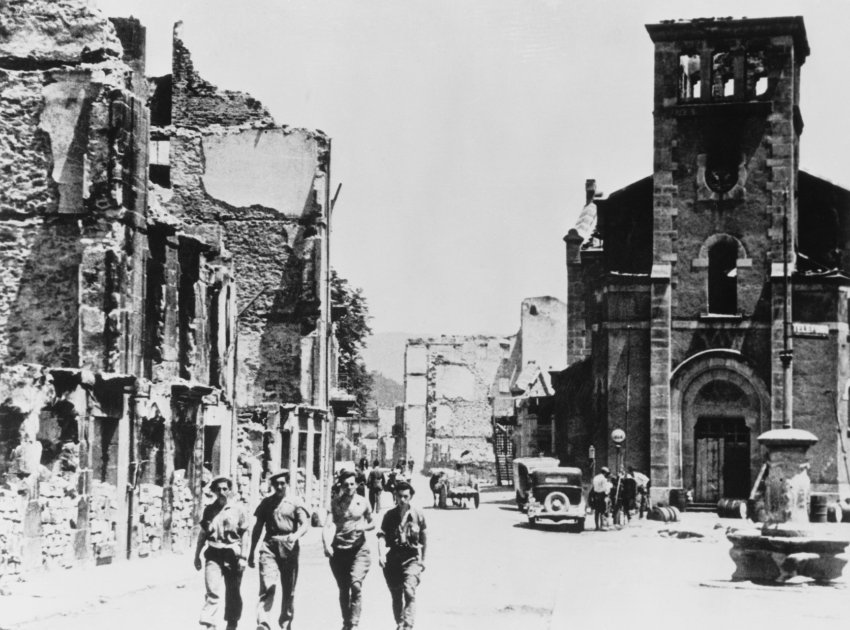 Troops Walking by Demolished Buildings