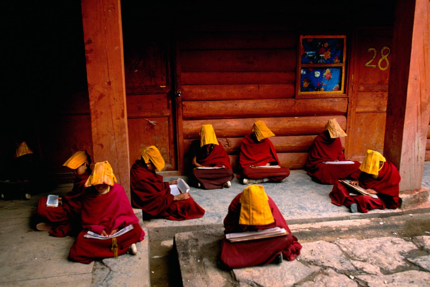 Young monks study Buddhist scripture at a monastery in Lithang, Tibet, 1999.