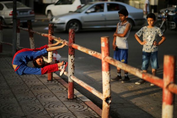 a-palestinian-boy-who-is-nicknamed-spiderman-and-hopes-to-break-the-guinness-world-records-with-his-bizarre-feats-of-contortion-demonstrates-acrobatics-skills-in-gaza-city