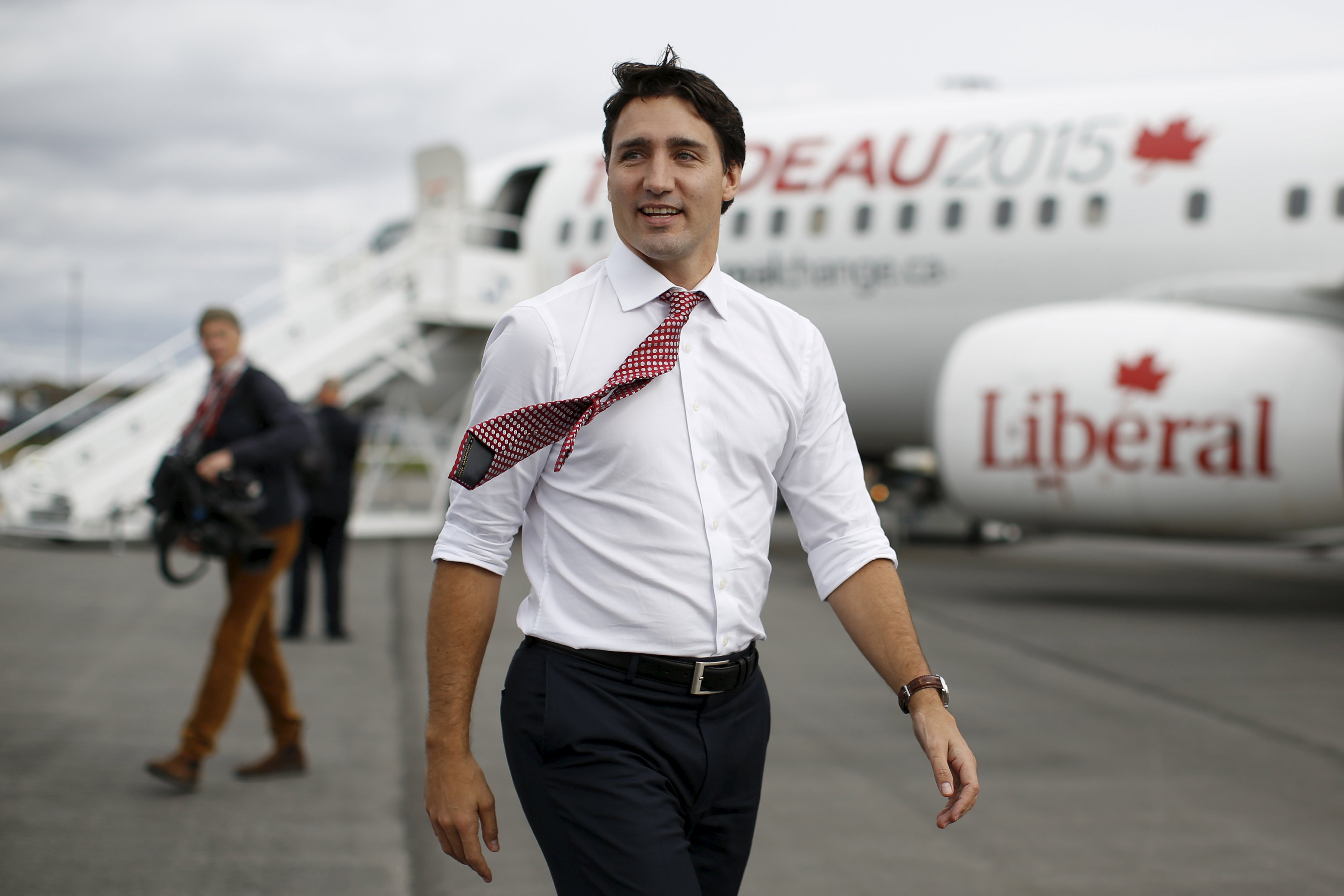 Liberal leader Trudeau walks on the tarmac after arriving in Saint John