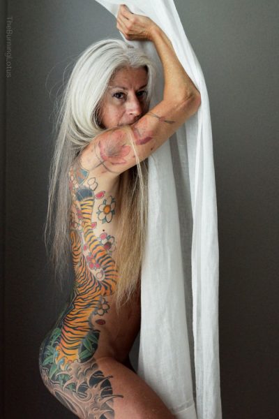 56-year-woman-body-piercing-tattoo-julie-burning-lotus-8-58b3dc3390431-jpeg__700