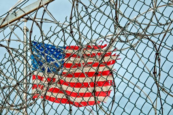 American-fleg-behind-a-prison-fence