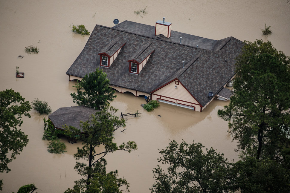 HOUSTON, TEXAS -- TUESDAY, AUGUST 29, 2017: A house sits completely submerged in flood water in the wake of Hurricane Harvey in Houston, Texas, on Aug. 29, 2017. (Marcus Yam / Los Angeles Times)